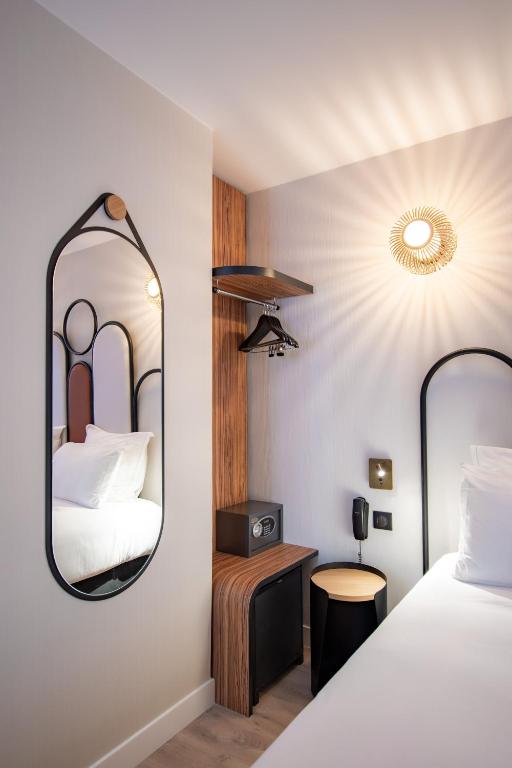 Détail chambre Hôtel de l’Espérance - Booking